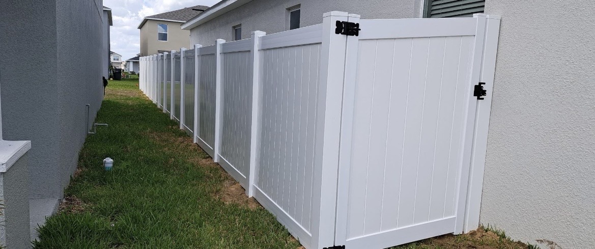 White vinyl privacy fence and gate installed by LCS Fence